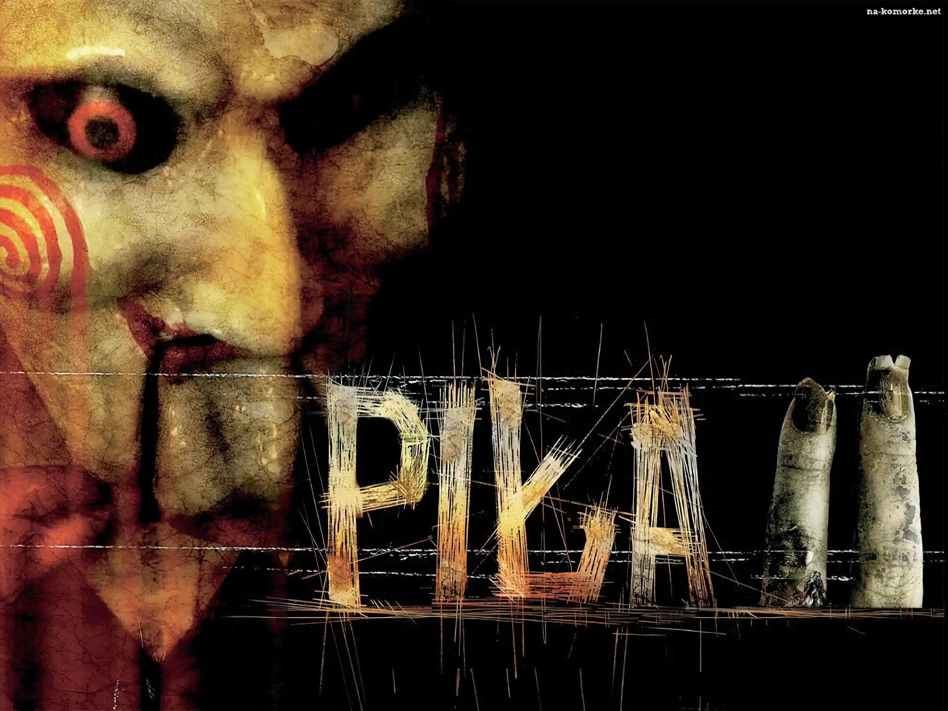 Piła 2, palce, maska, napis